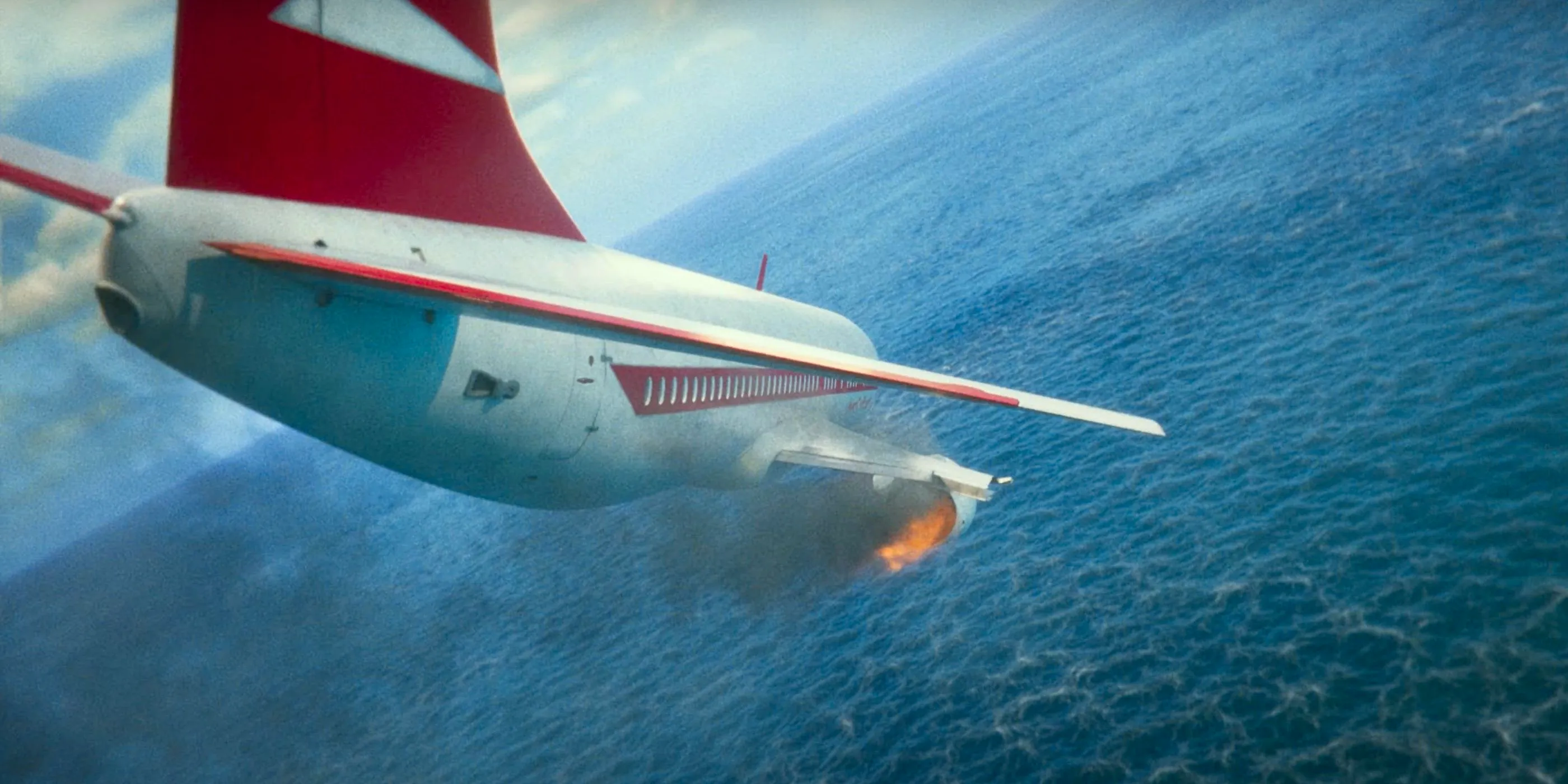 A burning plane crashes into the ocean in Beetlejuice 2 Image