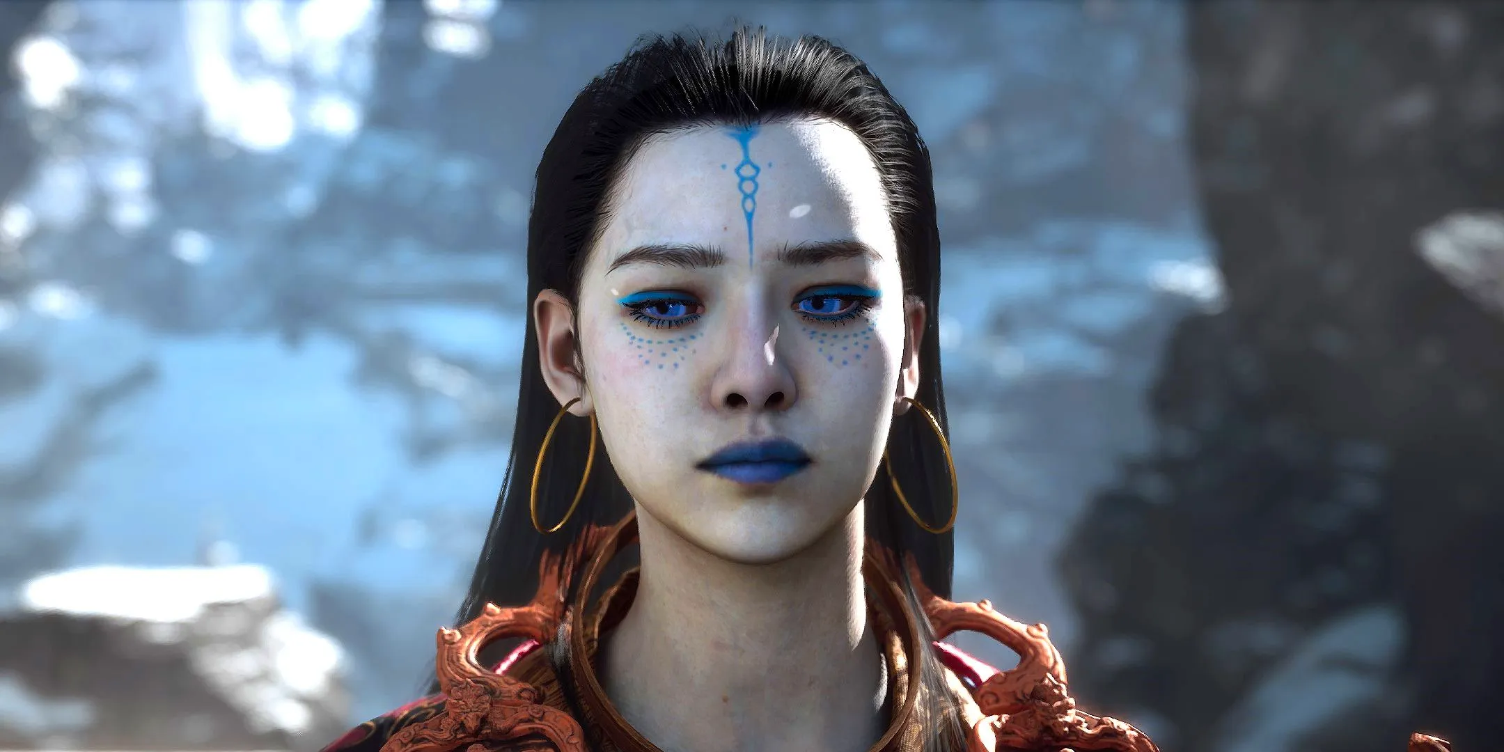 A close-up of Black Myth Wukong boss Kang-Jin Star, a woman with pale skin and blue makeup. Image