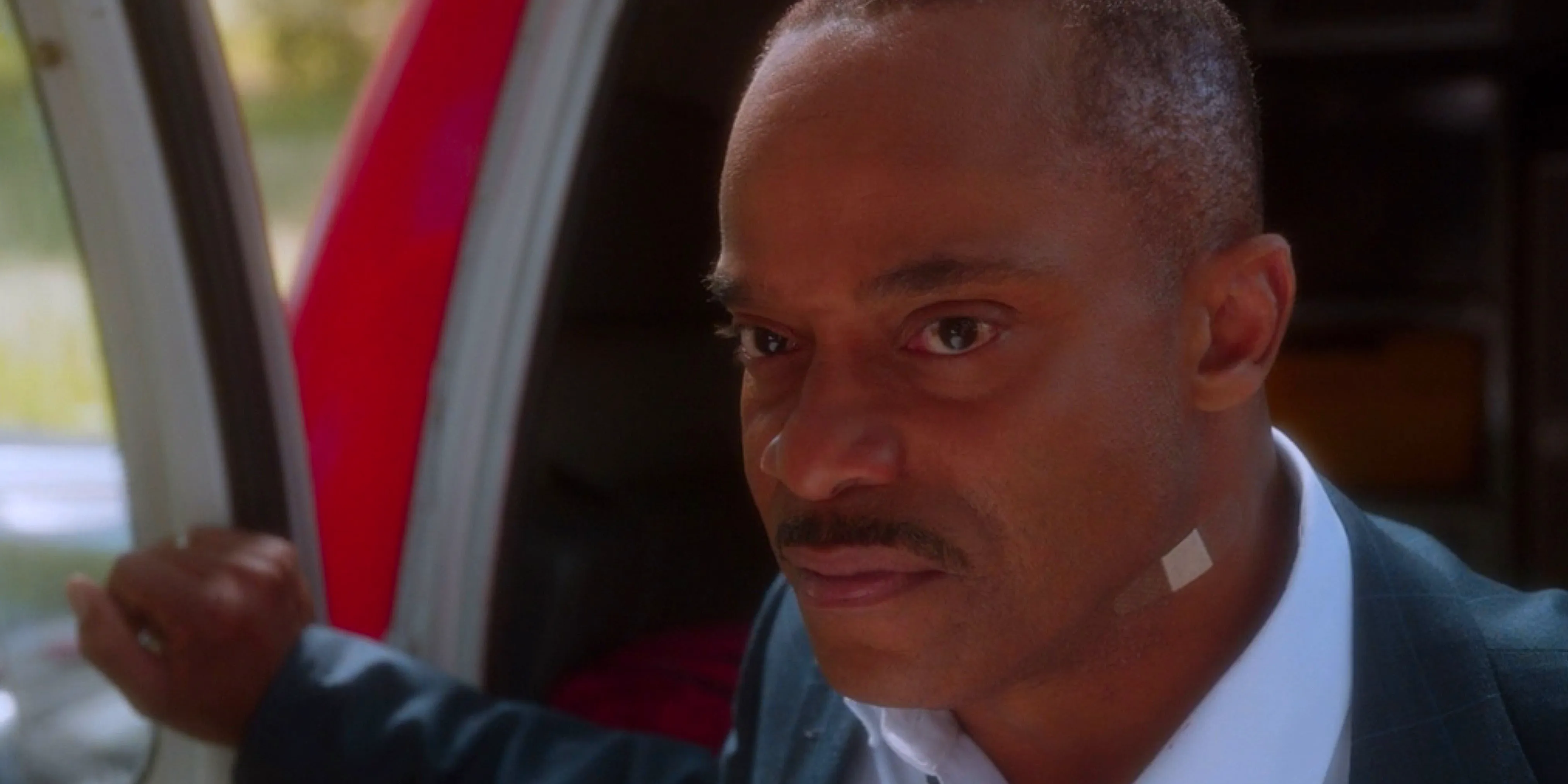 A close up of Rocky Carroll as Leon Vance sporting a band-aid in NCIS Image