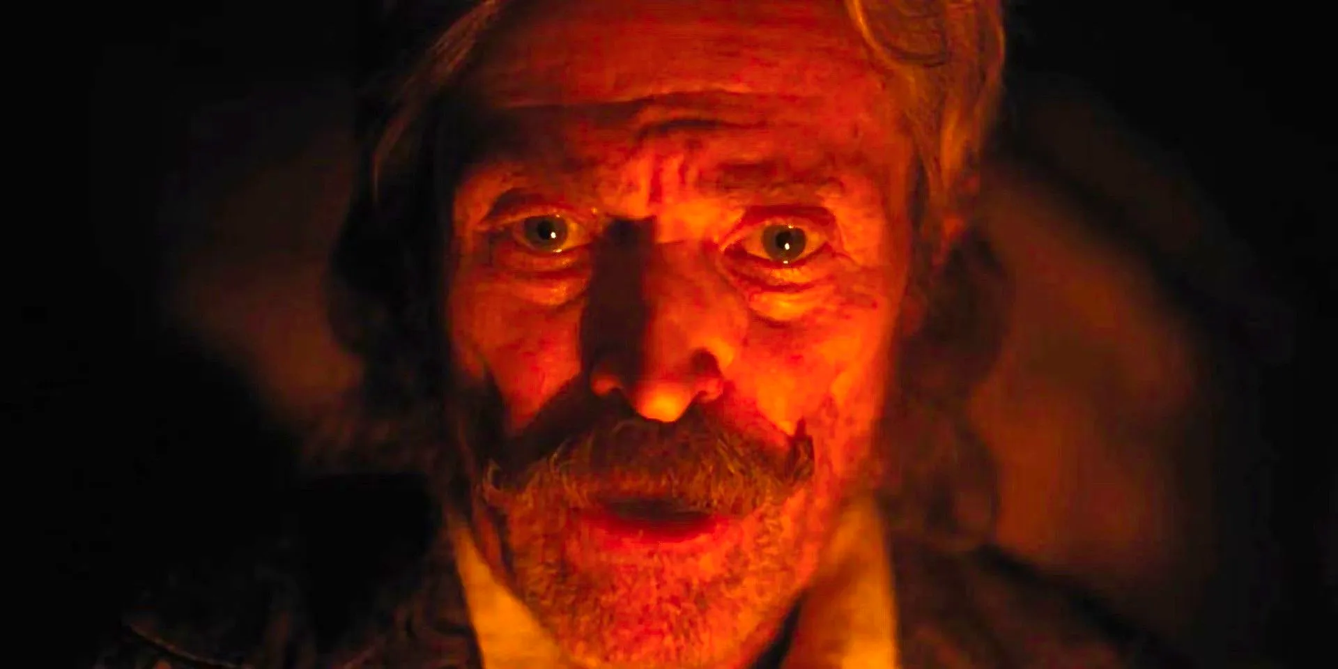 A close-up of Willem Dafoe with a mustache in Nosferatu Image