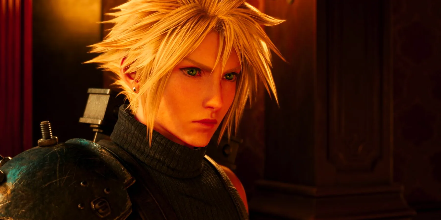 A close-up on Cloud Strife from Final Fantasy 7 Rebirth. He has messy blond hair and wears a black, sleeveless turtleneck underneath armor. Image