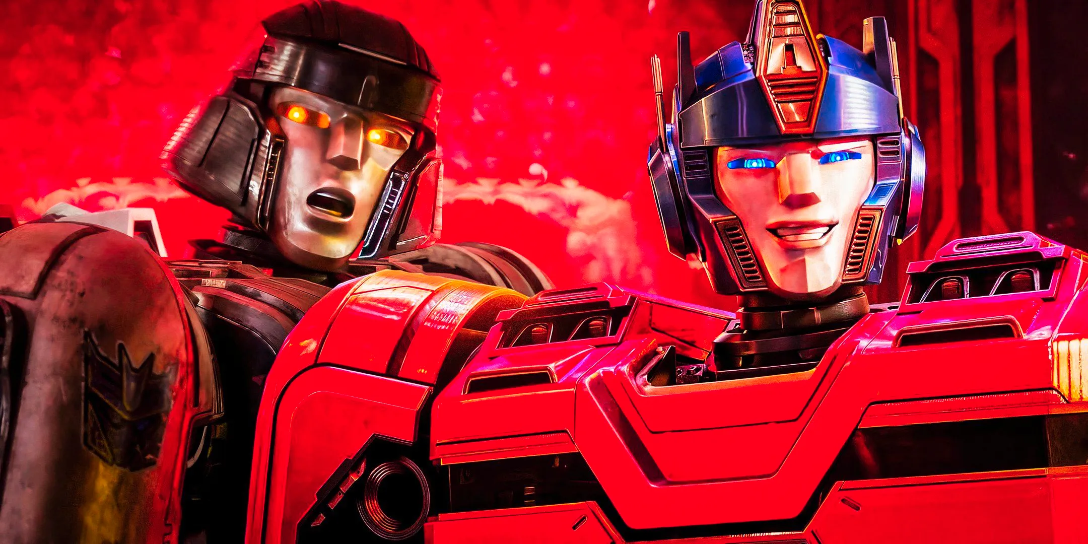 A composite image of Optimus Prime smiling with Megatron looking distraught against a red background in Transformers One Image