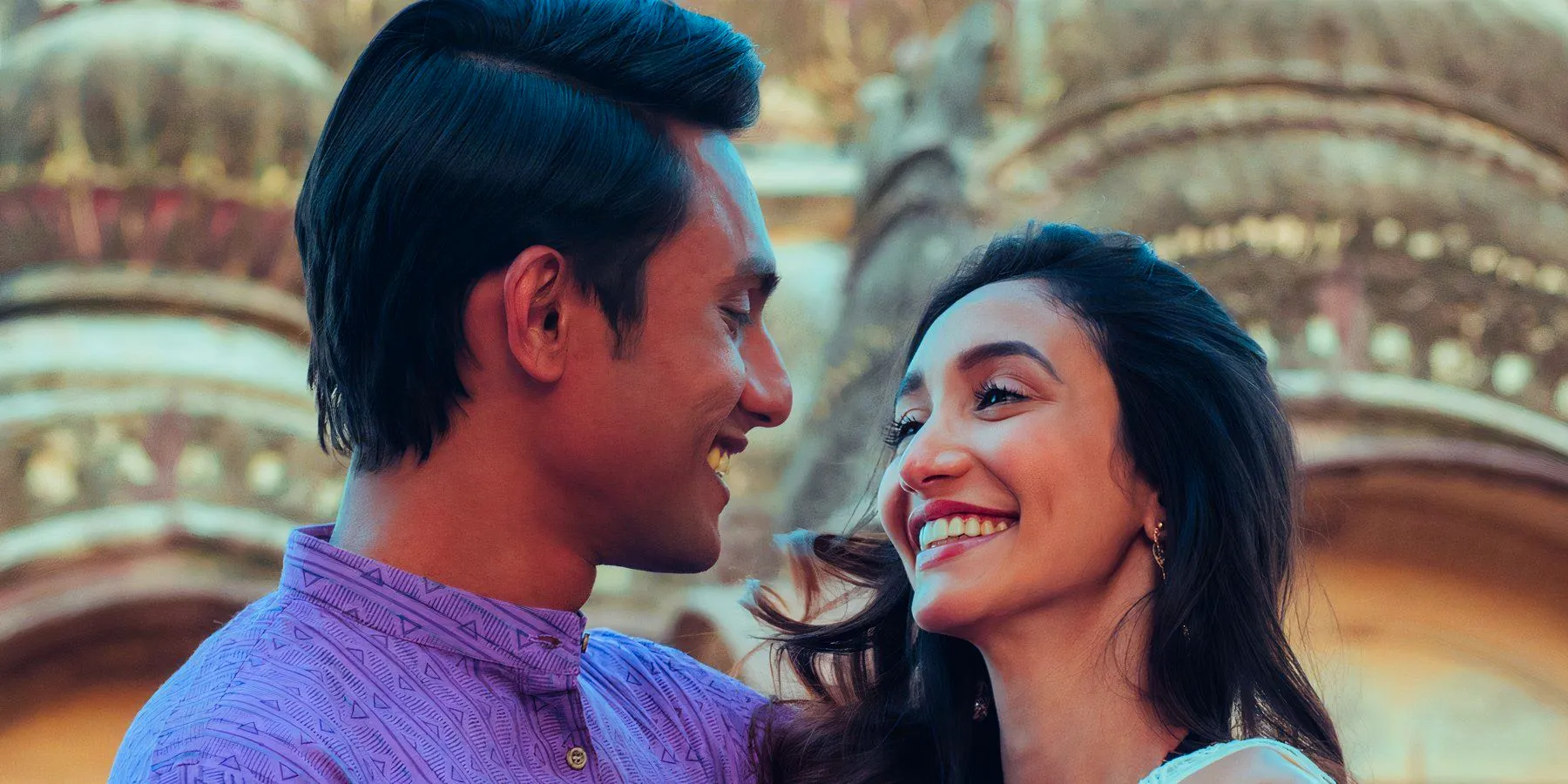 A man and woman smile at one another in the Hindi series Bandish Bandits Image