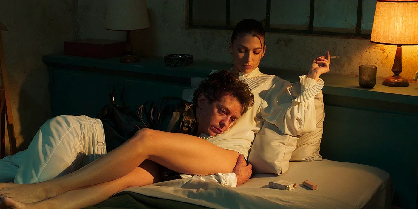 A man holds a woman smoking in bed in Kill the Jockey still Image