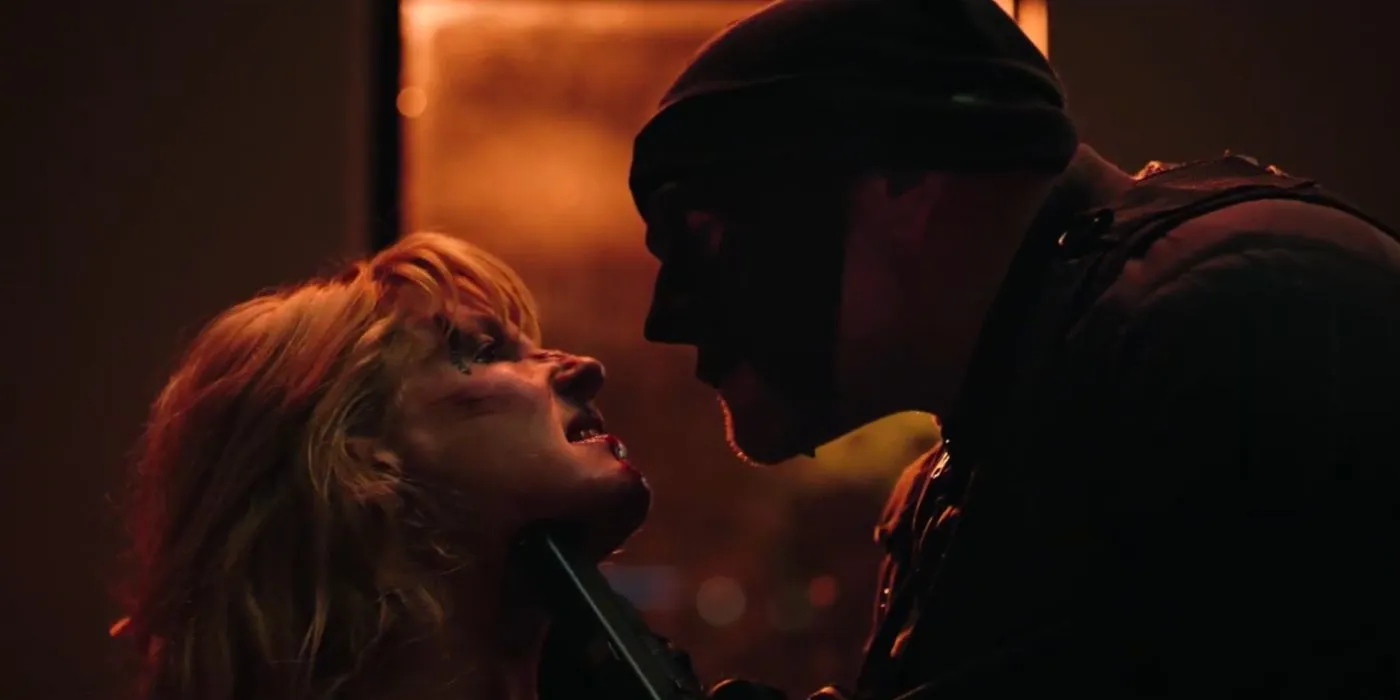 A masked man choking Beth (Kelly Reilly) in Yellowstone. Image