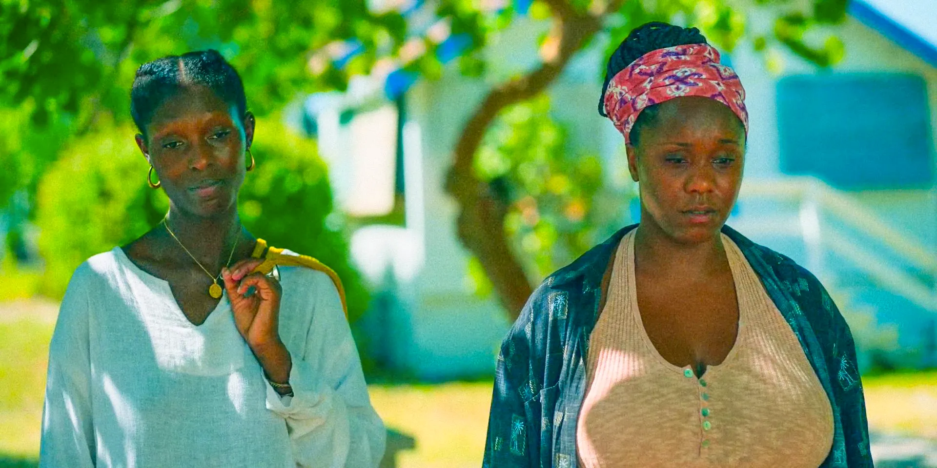 A mysterious woman and Grace (Jodie Turner-Smith) visiting her mother's grave in Bad Monkey Season 1 Episode 9 Image