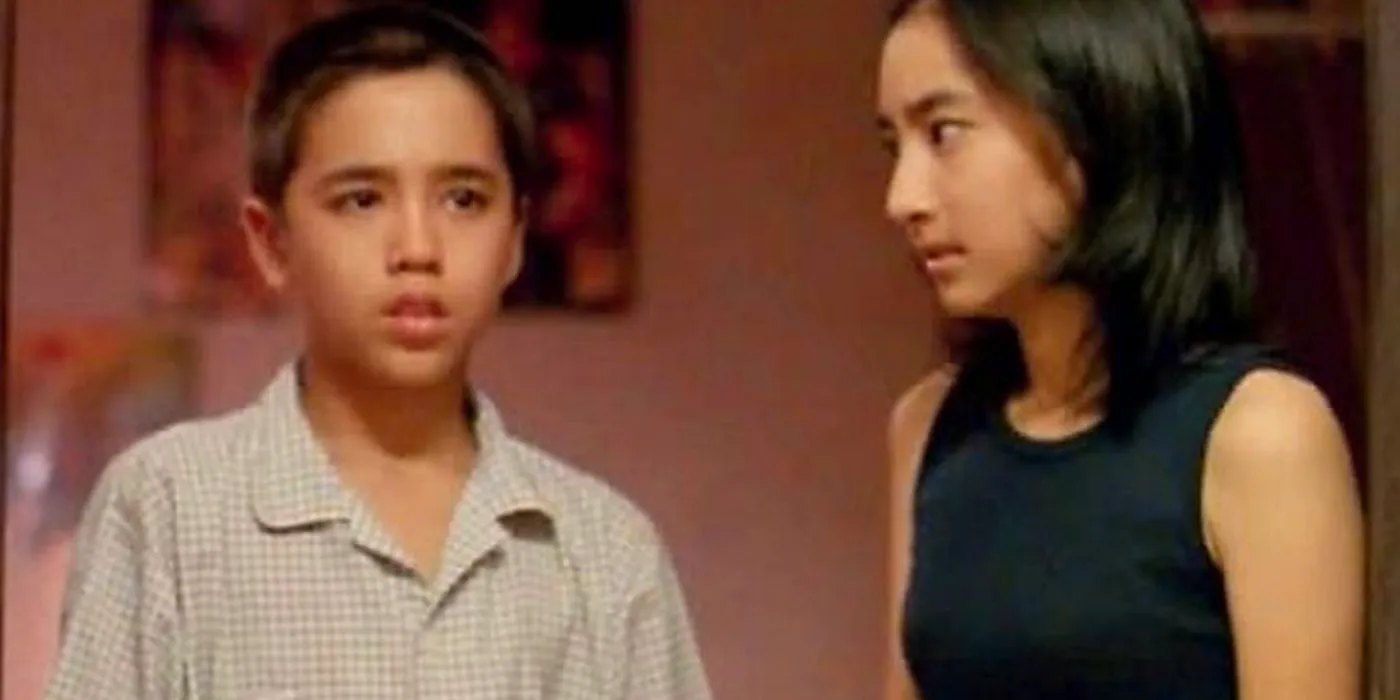 A scene from House of Ghosts with two characters staring Image