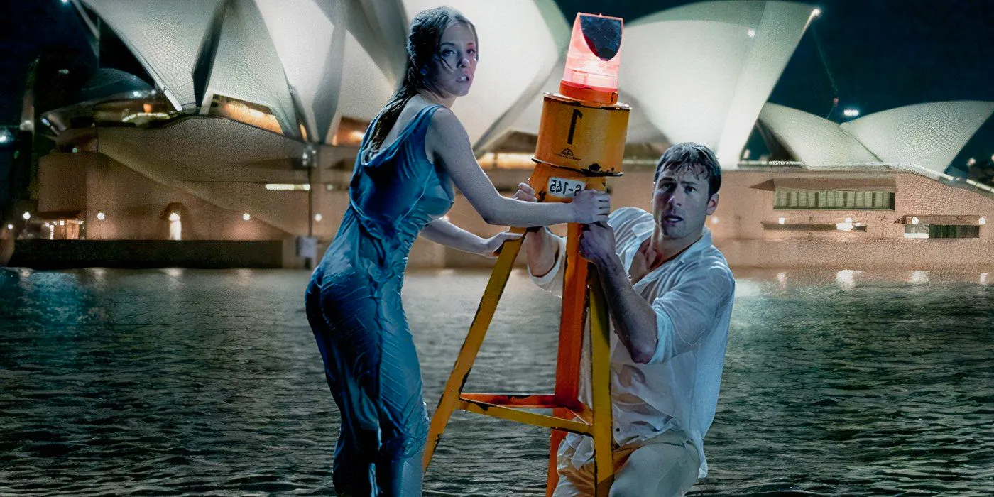 A soaking wet Ben (Glen Powell) and Bea (Sydney Sweeney) holding onto a buouy in the middle of the Sydney Harbour in Anyone But You Image