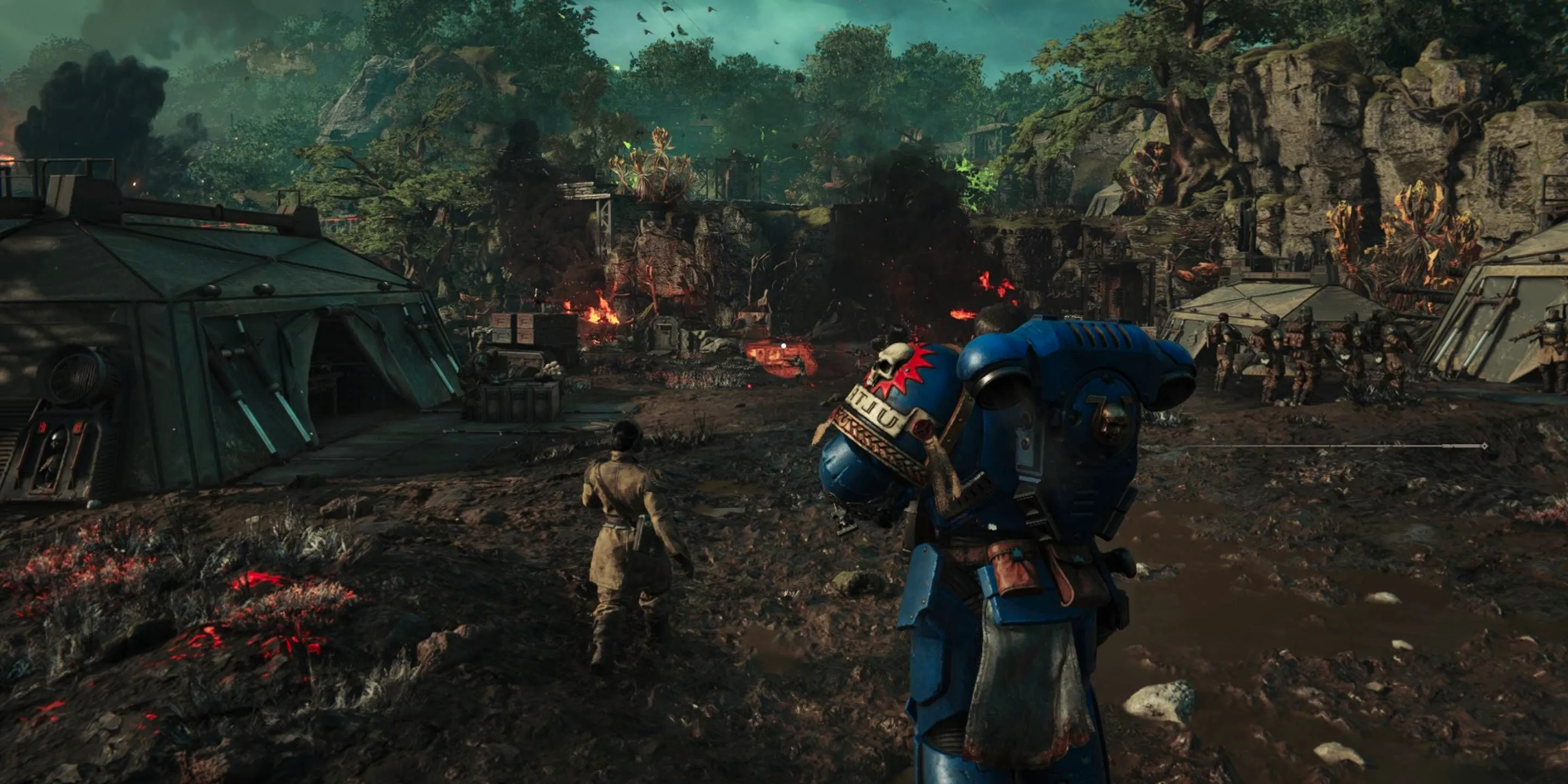 A Space Marine walking next to a Guardsman through a battleifled camp. Image