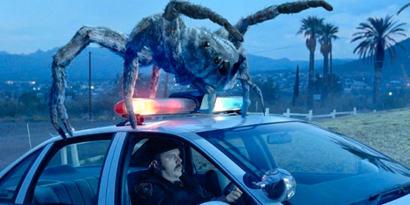 A spider climbs over a cop car in Eight Legged Freaks Image