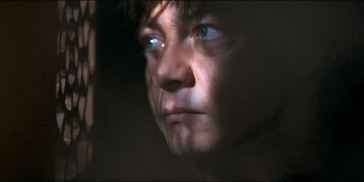 A young man looks through a vent in Misericordia Image