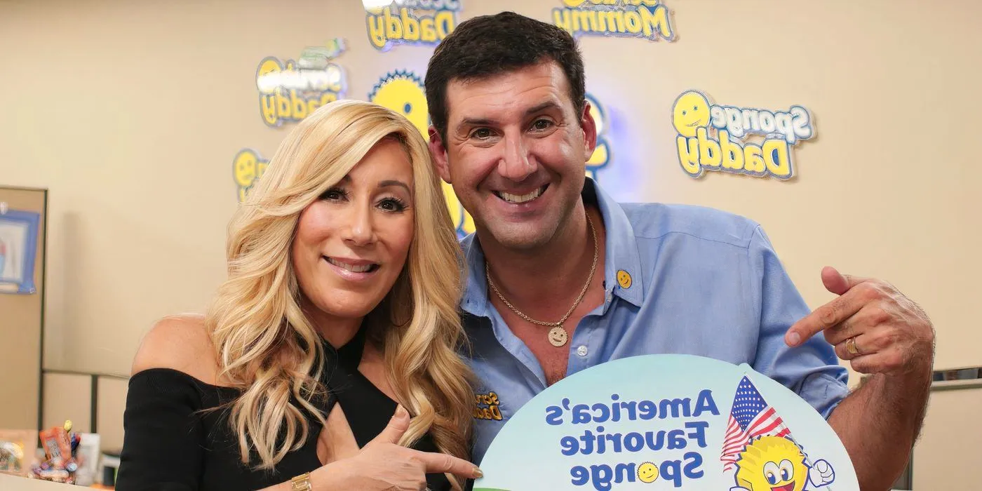 Aaron Krause and Lori Greiner holding up a Scrub Daddy product and smiling. Image