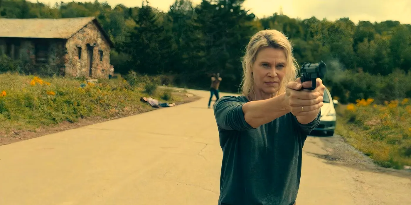 Abby Stevens (Lisa Ryder) with her gun drawn in From season 1 Image