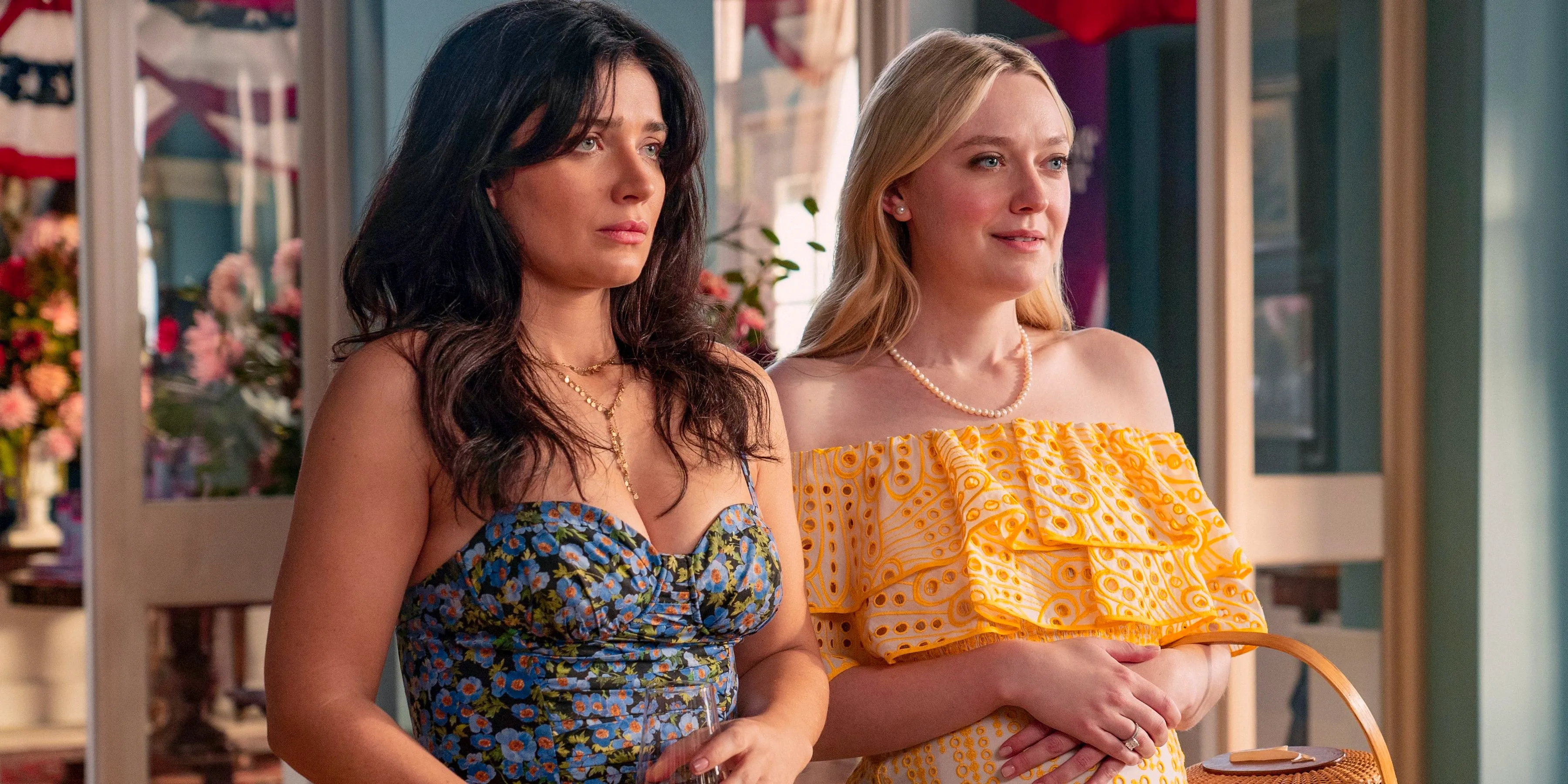 Abby Winbury (Dakota Fanning) and Amelia Sacks (Eve Hewson) looking at something in surprise in The Perfect Couple Image