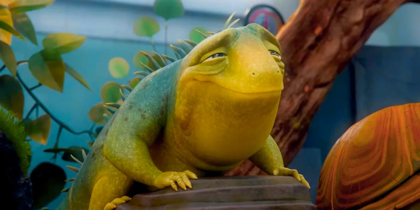 Adam Sandler as Leo the Lizard smiling in his tank in Leo Image