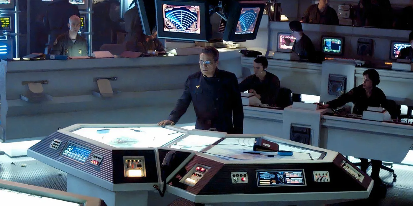 Adama standing in the CIC in Battlestar Galactica. Image