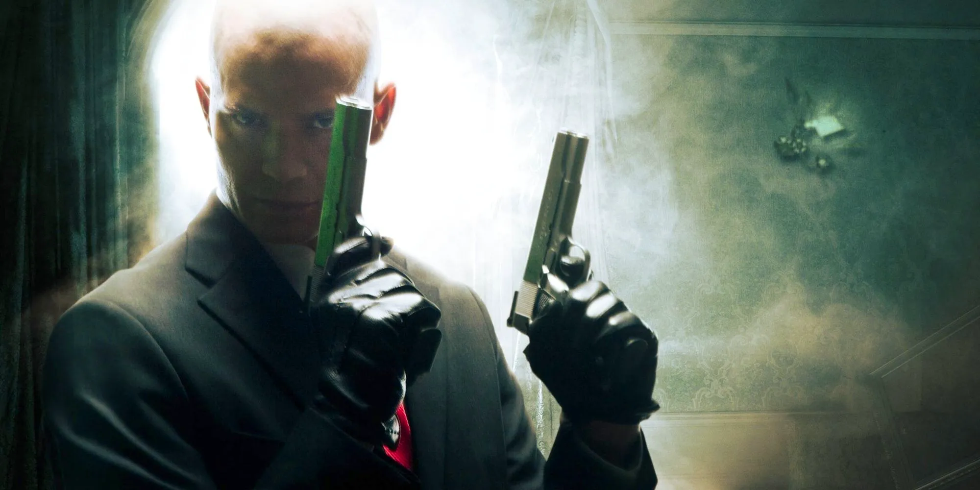 Agent 47 wielding guns in Hitman Image