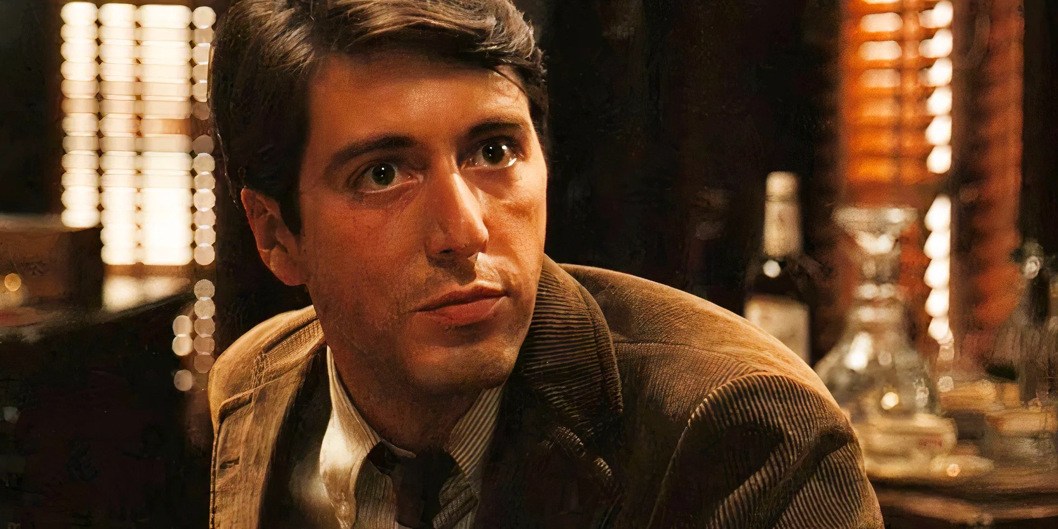 Al Pacino looking intensely at someone in The Godfather Image