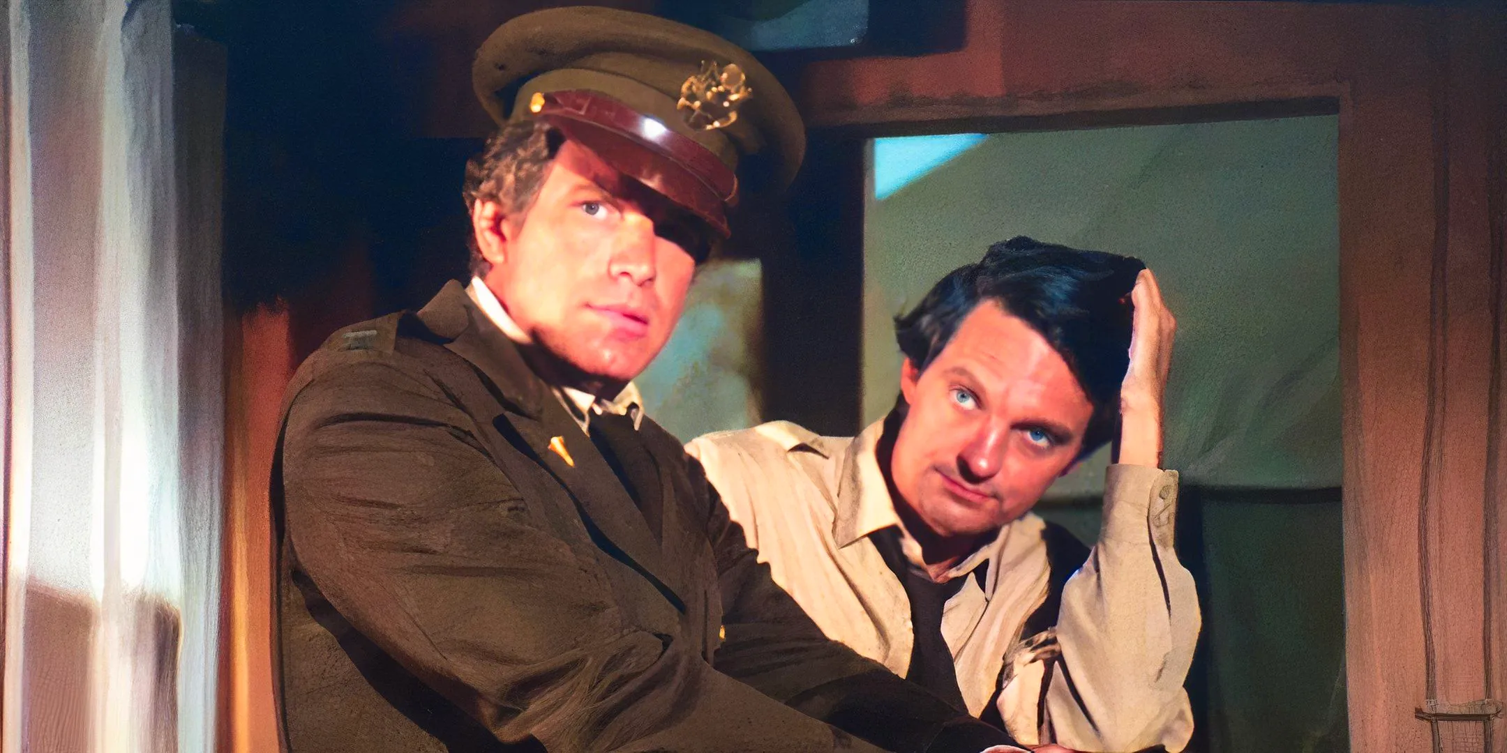 Alan Alda as Hawkeye and Wayne Rogers as Trapper wearing uniforms in MASH Image