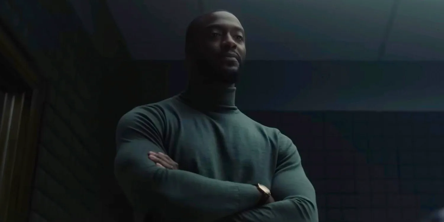 Alex Cross (Aldis Hodge) with his arms crossed and a challenging look in Cross Image