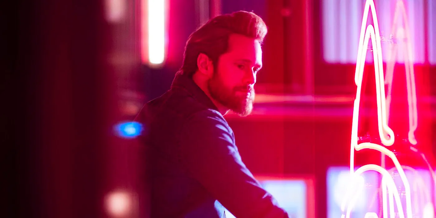 Alexander Skarsgard as Randall Flagg around neon lights in The Stand Image