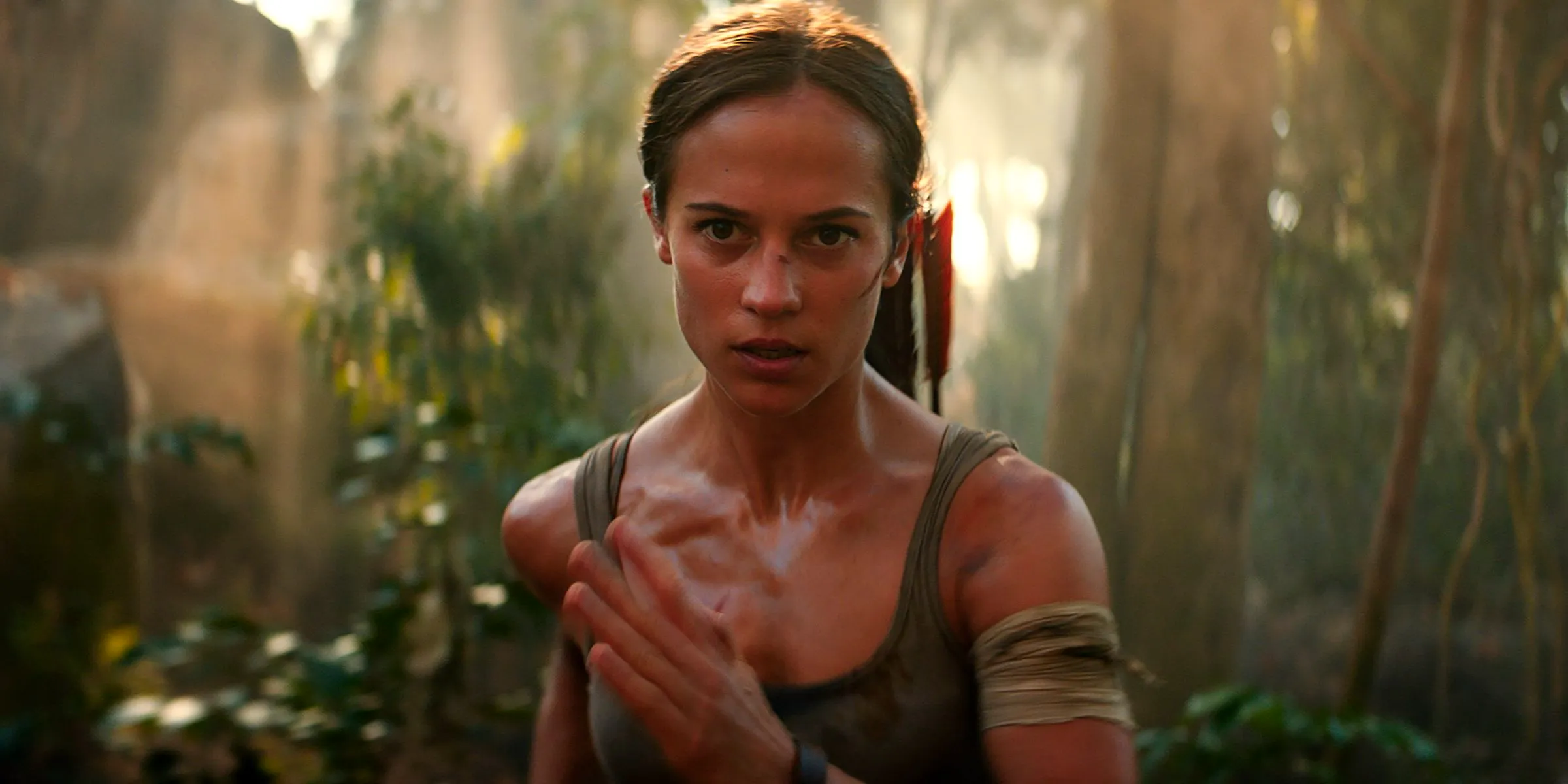 Alicia Vikander as Lara Croft running in Tomb Raider Image