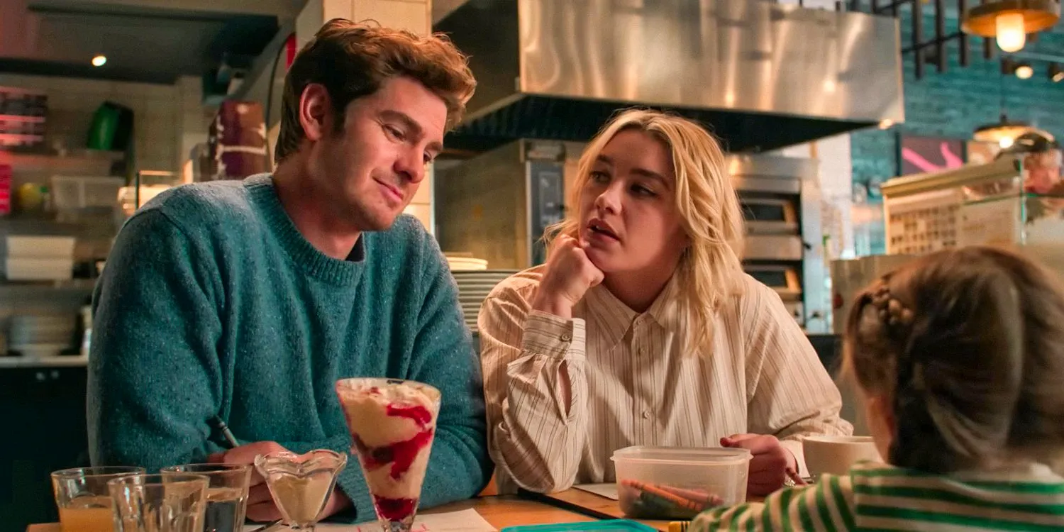 Almut (Florence Pugh) and Tobias (Andrew Garfield) about to give their young daughter some uncomfortable news in We Live in Time Image