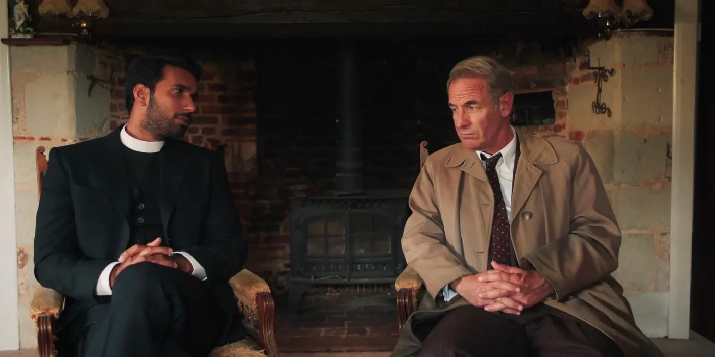 Alphy Kotteram (Rishi Nair) and Geordie Keating (Robson Green)sitting across from one another in Grantchester. Image