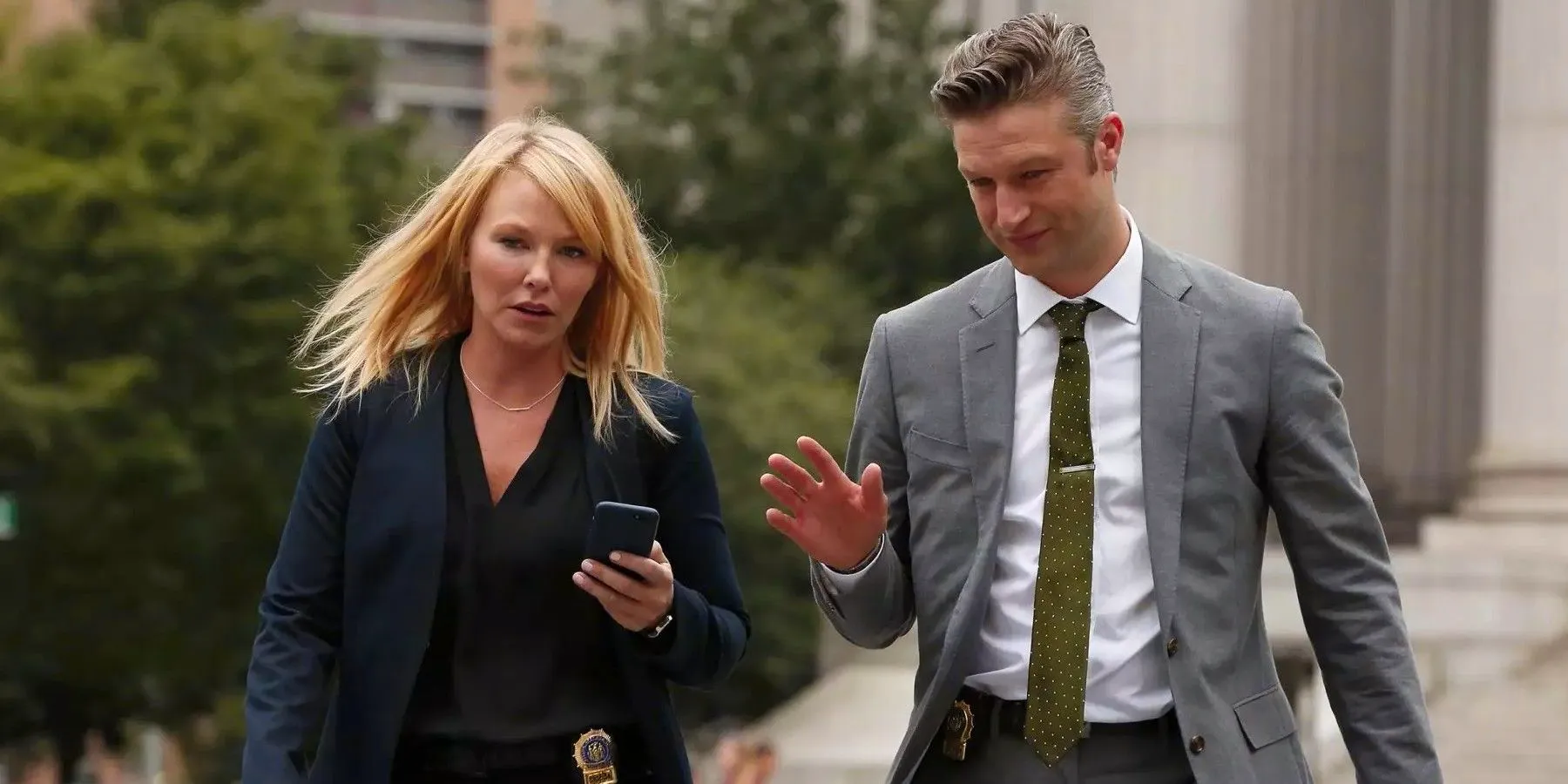 Amanda Rollins walking with her phone on Law & Order: SVU Image