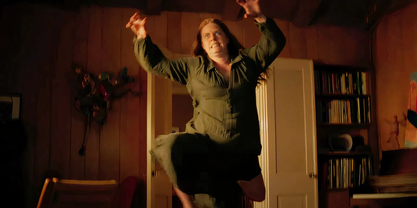 Amy Adams leaping through the air in Nightbitch Image