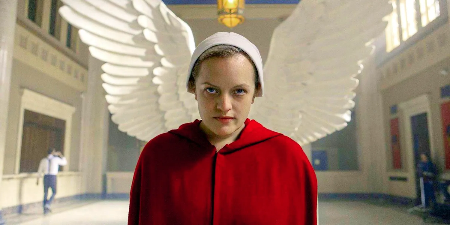 An image of June Osborne standing in front of angel wings in The Handmaid's Tale Image