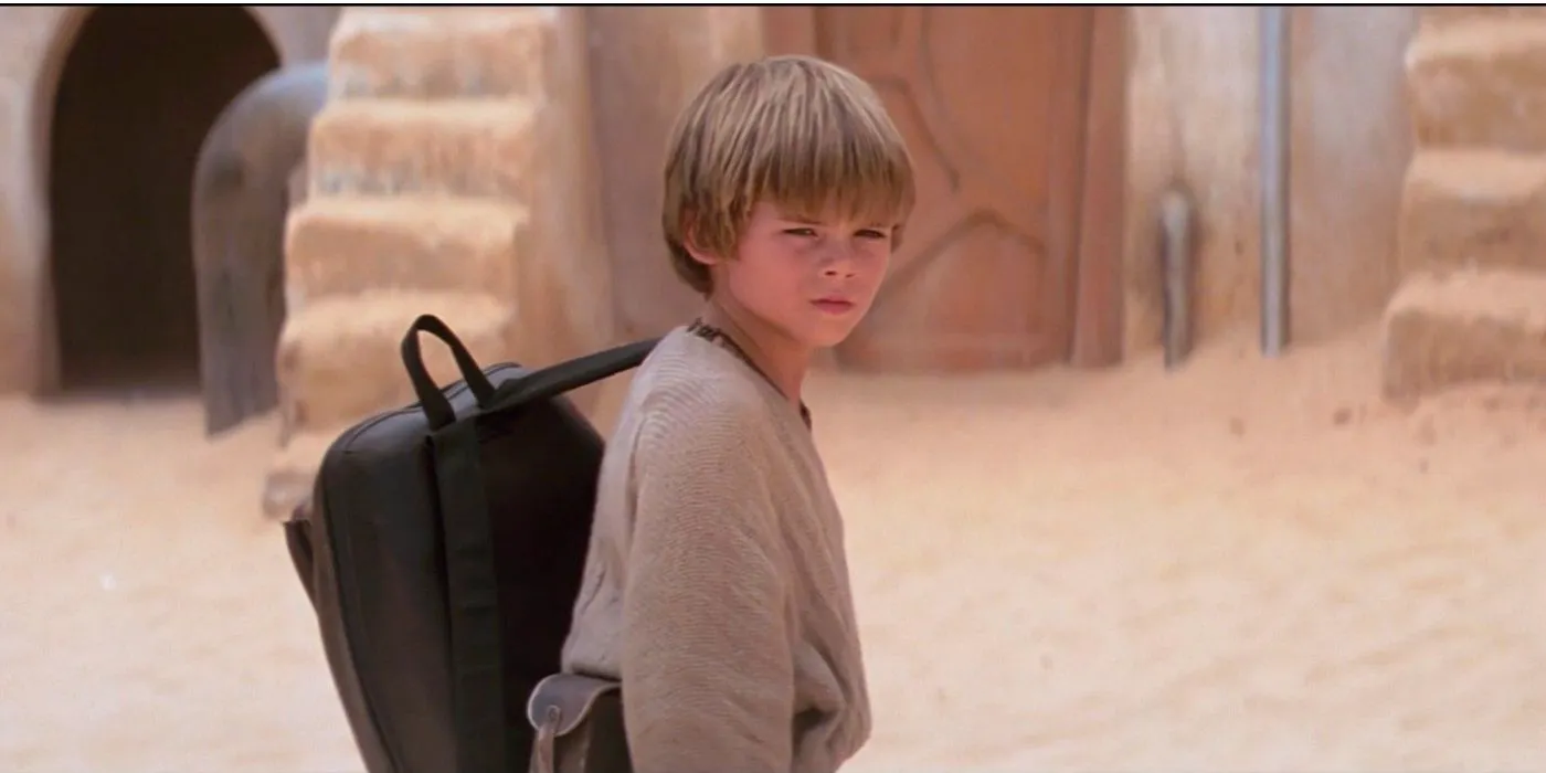 Anakin Skywalker looks toward the camera with a serious expression in The Phantom Menace. Image