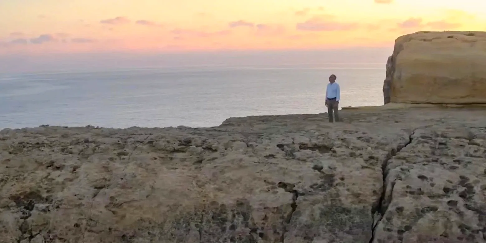 Ancient Apocalypse on Netflix with Graham Hancock standing on a cliff side Image