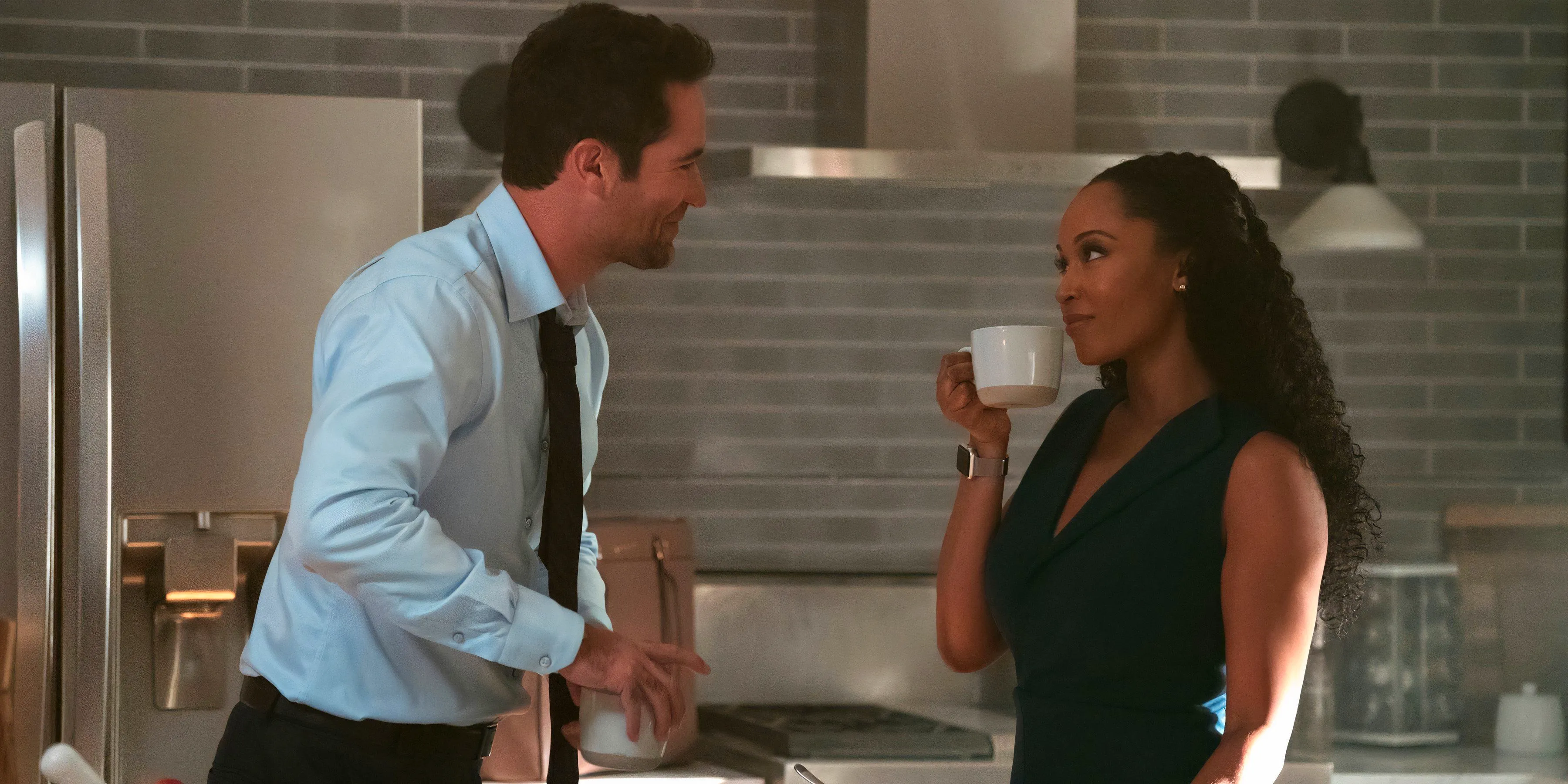 Andy and Mickey smile at each other in the kitchen in The Lincoln Lawyer season 3 episode 3 Image