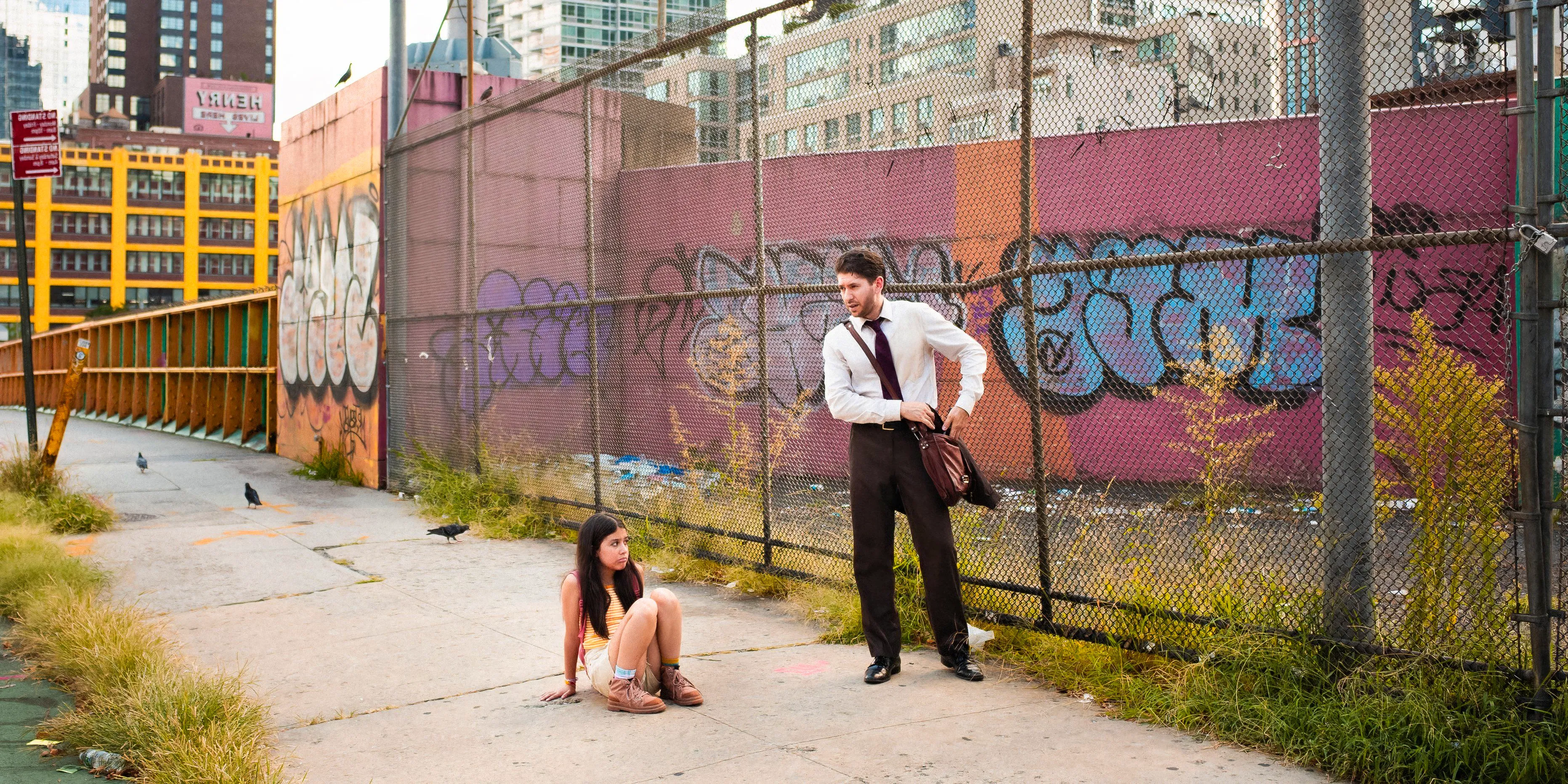 Andy looks down at Anna sitting on the sidewalk in Notice to Quit Image