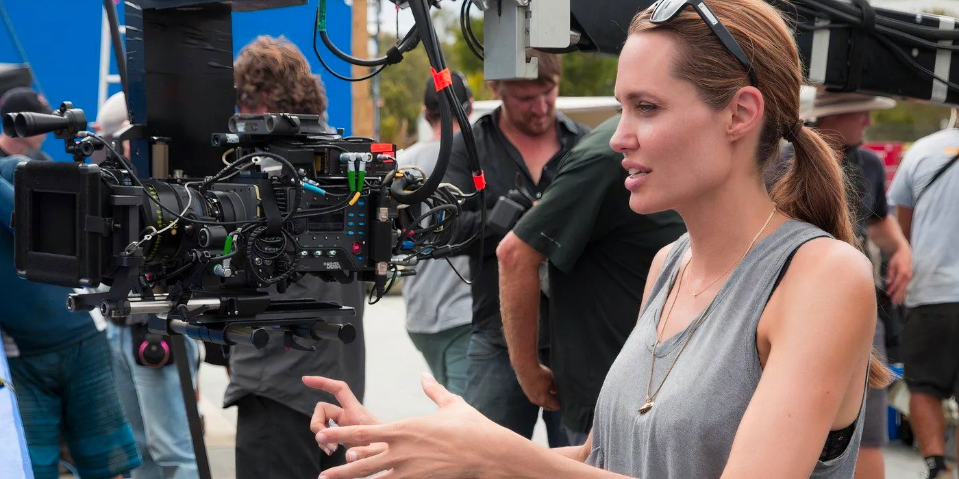 Angelina Jolie directing on a movie set Image