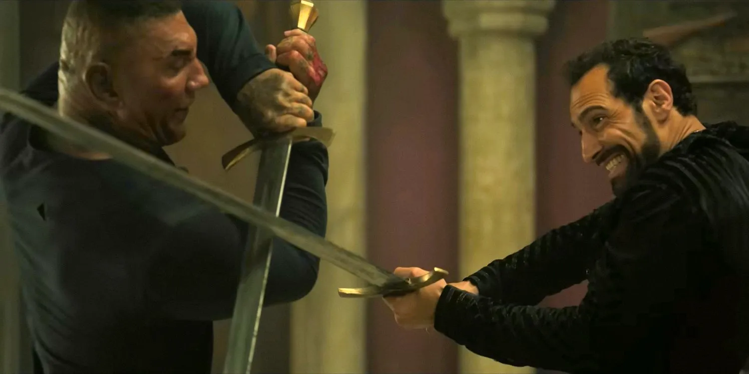 Angus Mackenzie (Scott Adkins) and Joe Flood (Dave Bautista) in a sword fight in The Killer's Game (2024) Image