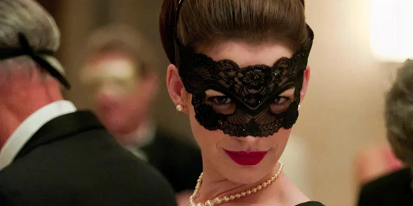 Anna Hathaway as Selina Kyle wearing a mask in the ball scene in The Dark Knight Rises Image