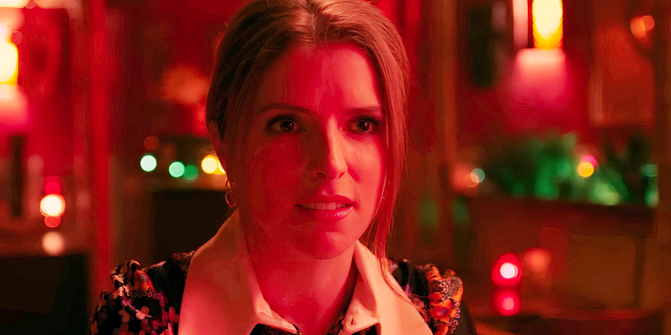 Anna Kendrick smiling at a bar in Woman of the Hour Image