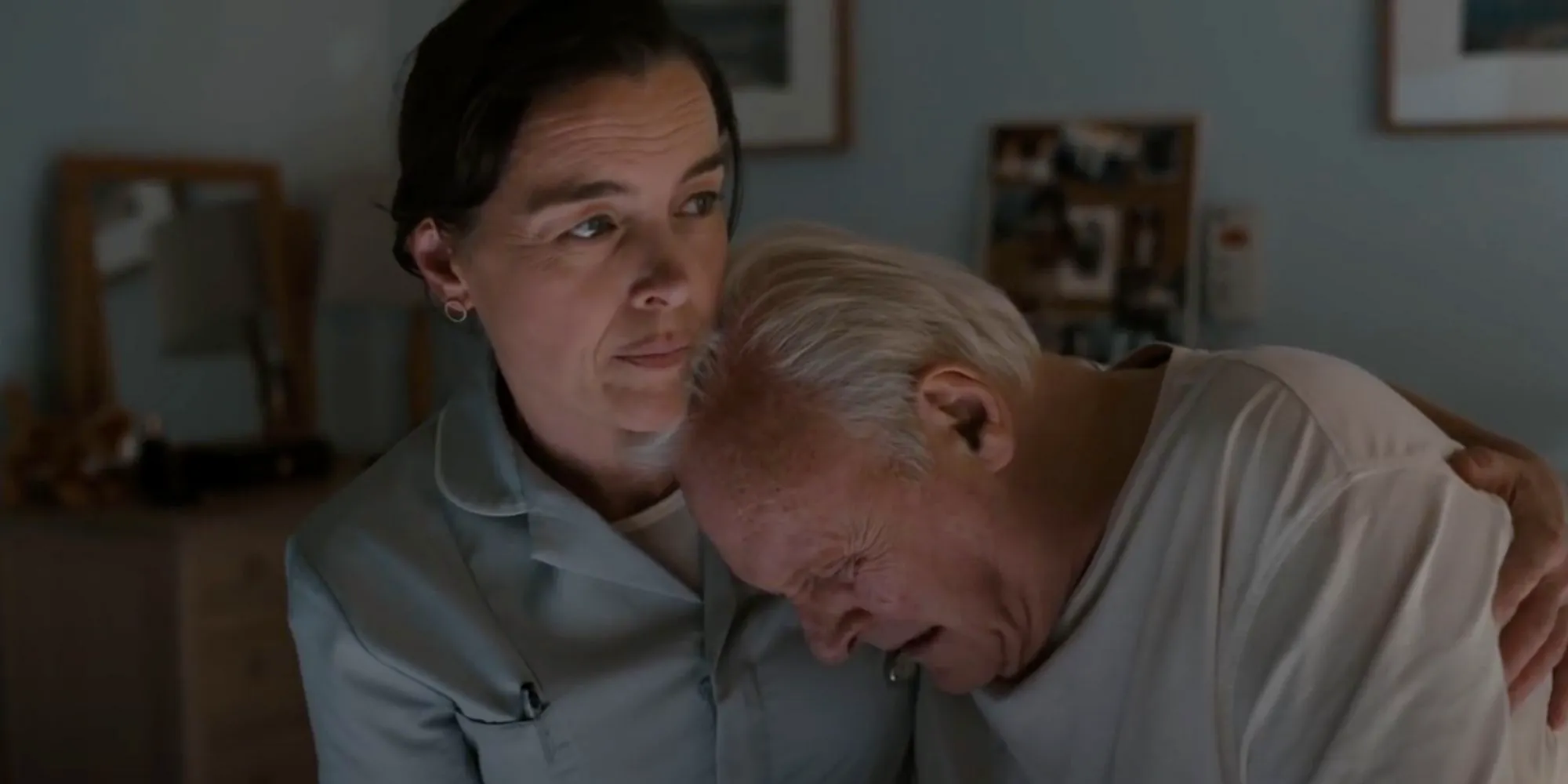 Anthony Hopkins as Anthony crying on Catherine's shoulder in The Father Image