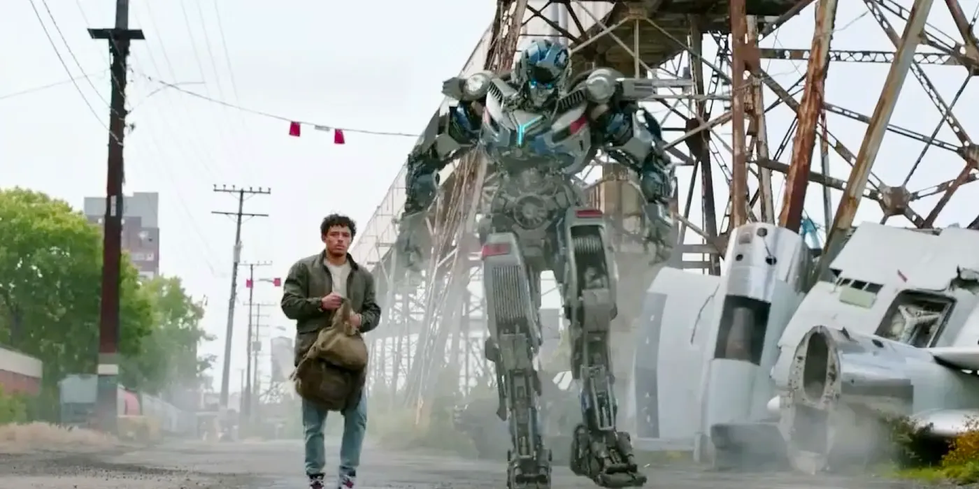 Anthony Ramos as Noah and Mirage Walking in the Debris in Transformers 7 Image