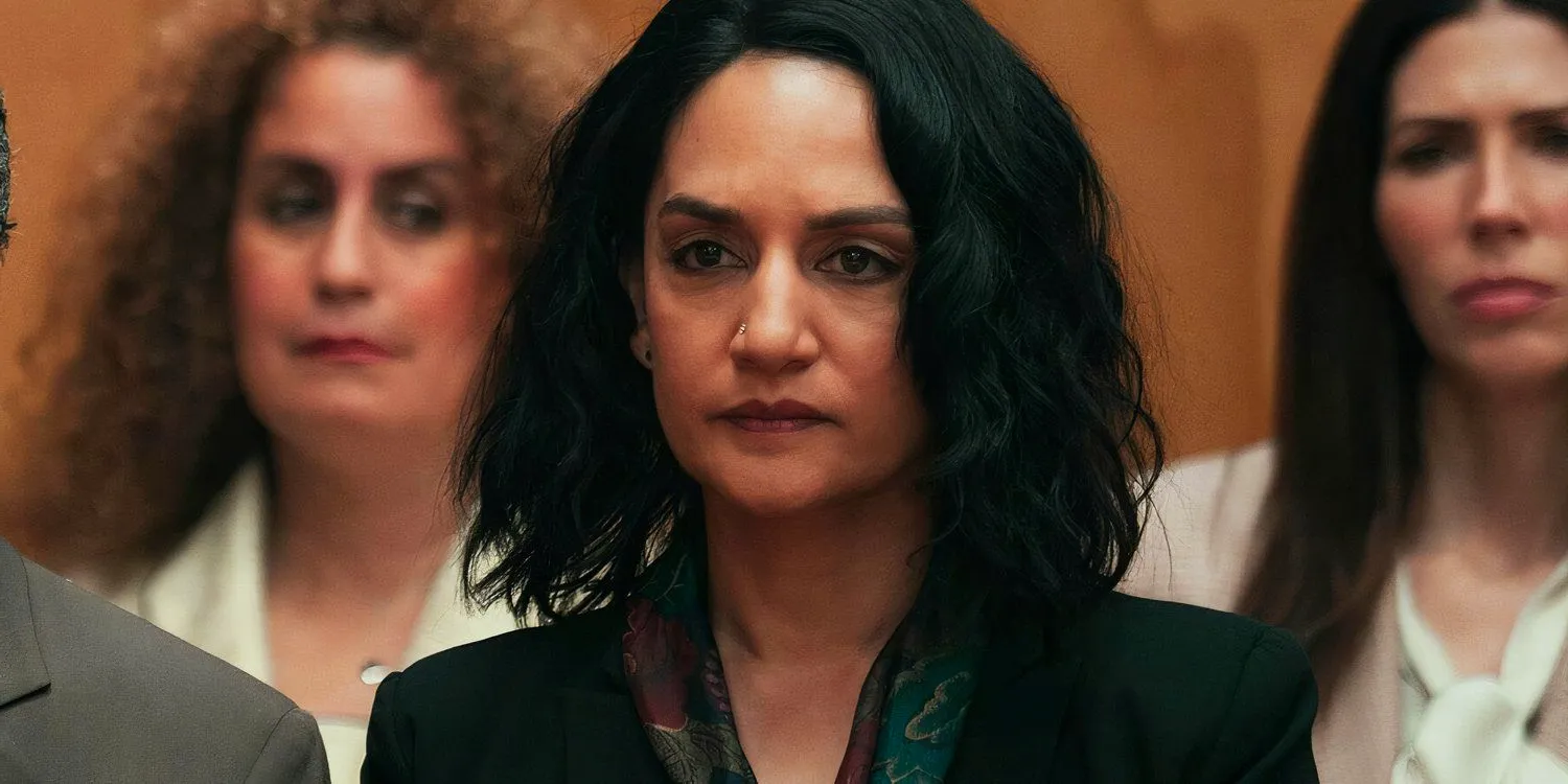 Archie Panjabi as Suman sitting in a court room in Under the Bridge Image