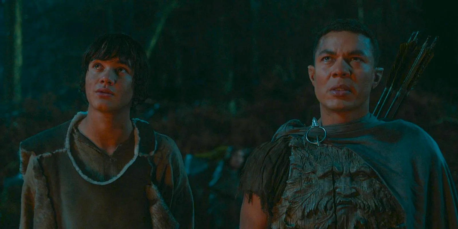 Arondir (Ismael Cruz Córdova) and Theo (Tyroe Muhafidin) reunite and say goodbye to the giant trees in The Lord of the Rings: The Rings of Power Season 2 Episode 4 Image