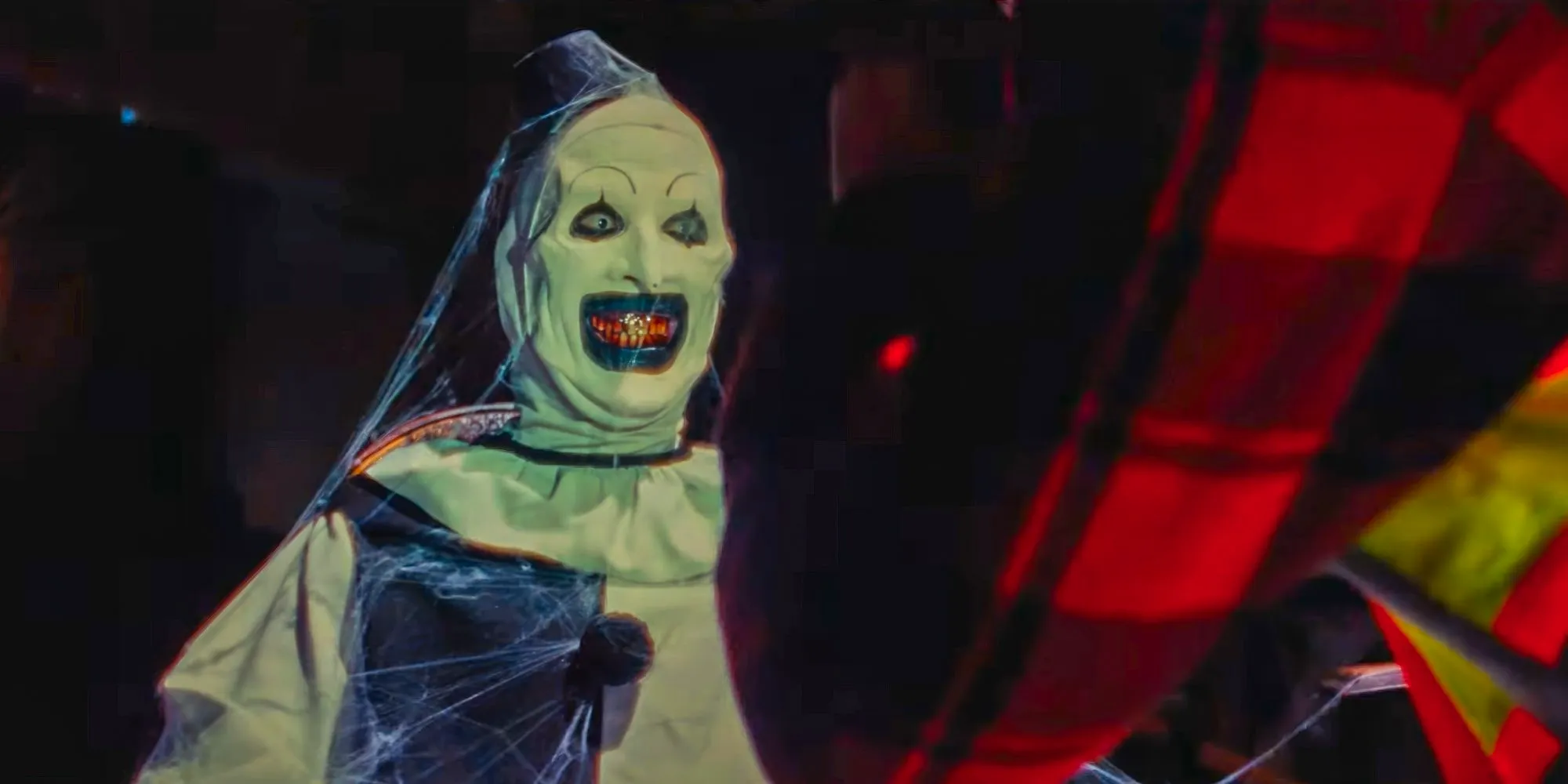 Art The Clown (David Howard Thornton) with some spiderwebs over him in Terrifier 3 Image