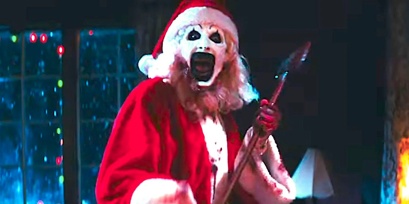 Art the Clown dressed as Santa Claus holding an axe in Terrifier 3's trailer-1 Image