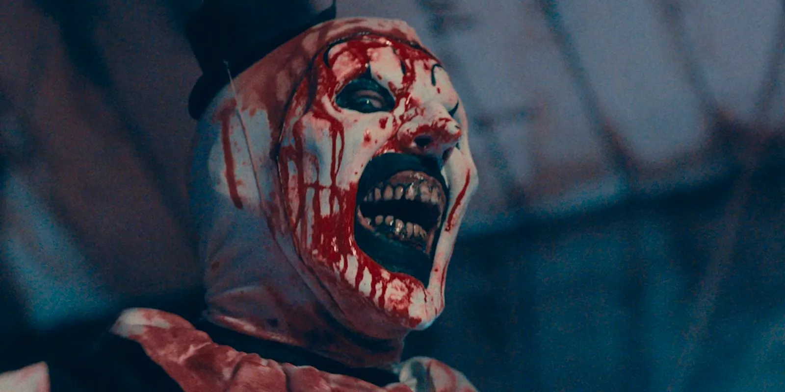 Art the Clown smiling in Terrifier 2 Image