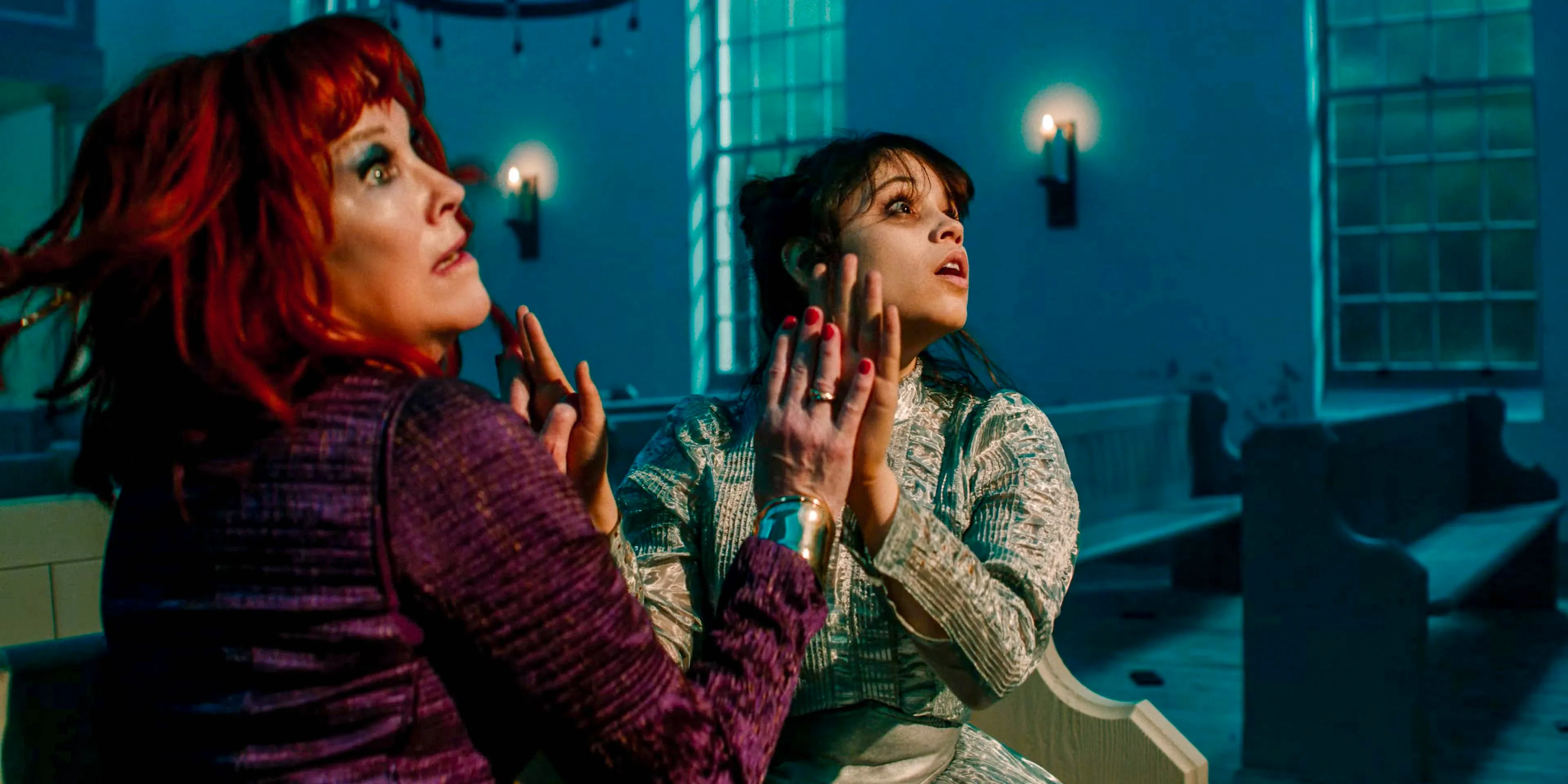 Astrid (Jenna Ortega) and Delia Deetz (Catherine O'Hara) playing a hand game against their will in Beetlejuice Beetlejuice Image