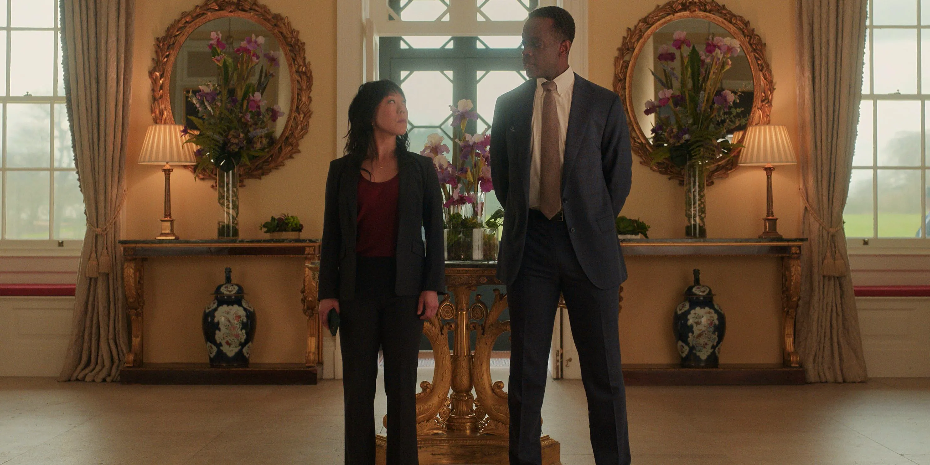 Ato Essandoh & Ali Ahn standing next to each other in The Diplomat season 2 Image