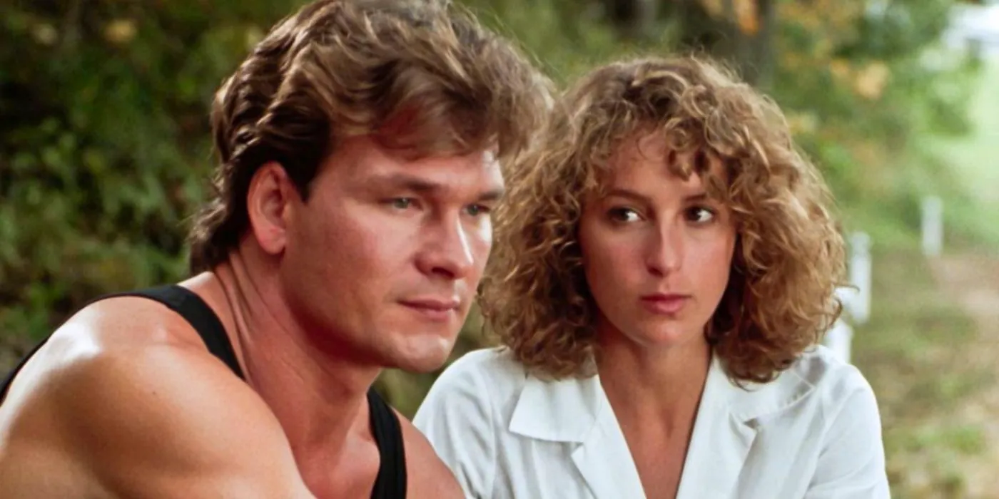 Baby (Jennifer Grey) looking at Johnny (Patrick Swayze) while he looks in the distance in Dirty Dancing Image