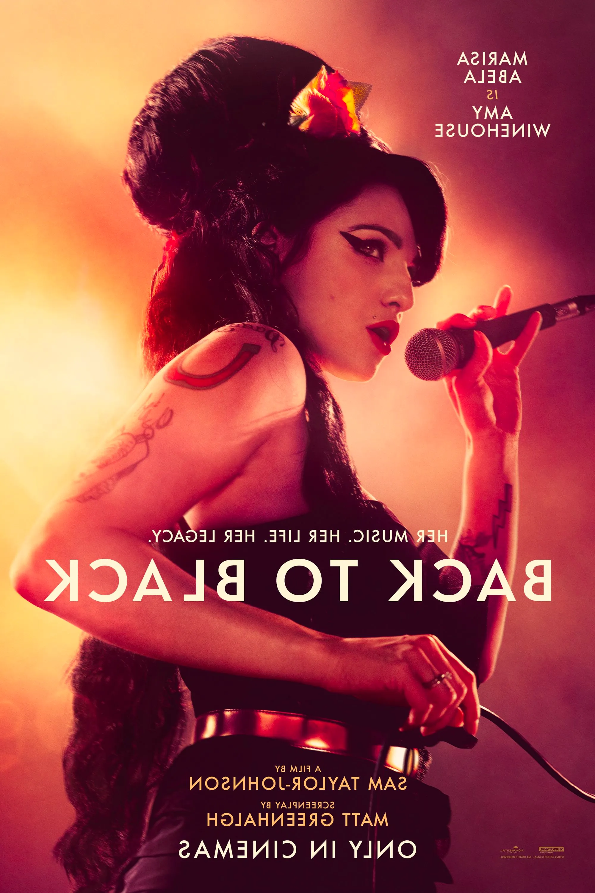 Back to Black Movie Poster showing Marisa Abela as Amy Winehouse Holding a Microphone Image